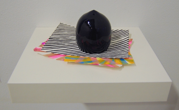 One of Brian Giniewski's paperweights and its unique paper prints.
