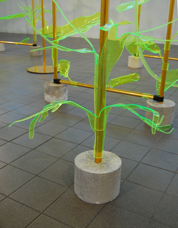 Concrete bases and plastic leaves in the structure.