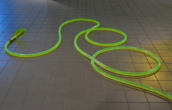 Some of the tubes coil down along the floor.