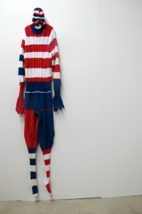 "Big S Man" by Mark Newport, who balances out the masculine form of the superhero with knitted renderings