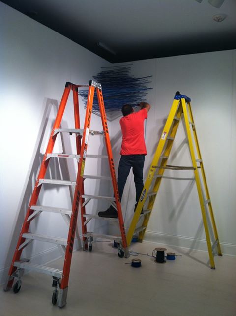 Randy Walker, installing "Aurora" for the exhibition. Photo courtesy of MMAA.