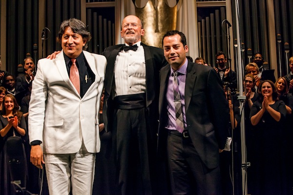 Composers Novelli Jurado (left) and Gerardo Cárdenas (right) take final bows at the ¡Cantaré! Community Concert with VocalEssence Artistic Director Philip Brunelle.