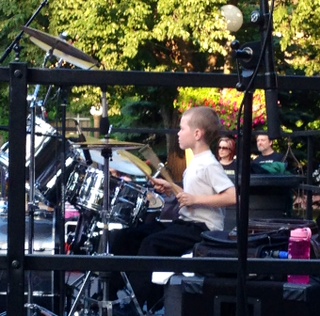 8-year-old Christopher Ebel playing drums for DyVersaCo Photo by Renee Prola