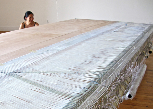 The artist drew upon her design experience for multiple aspects of the project, including the architecture of the original factory and the creation of the table loom.