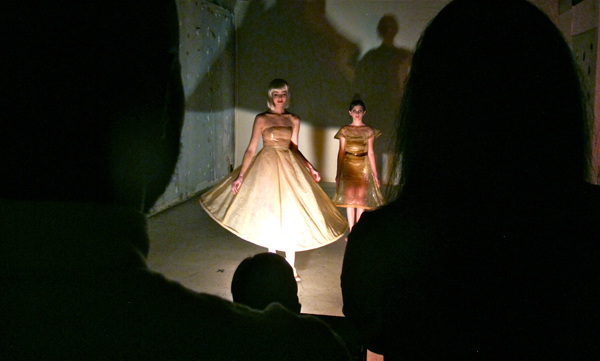 Installation by artist Cristin Richard, whose work is related to body and identity. Models wear skin dresses composed from hog intestines, dyed to match their specific skin color.