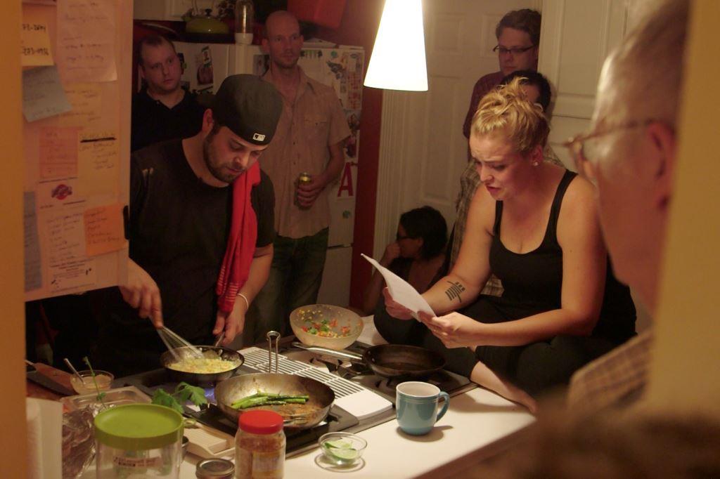 Samantha Johns and Lucas Koski in a kitchen performance at "Small Art 3". Photo courtesy of Ben McGinley.