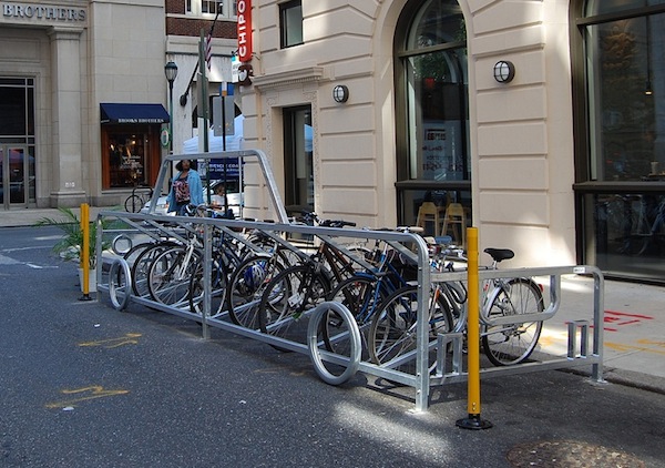 The bike corral at Walnut & Sydenham alludes to the parked car it replaced while providing safe parking for 14 bicycles.