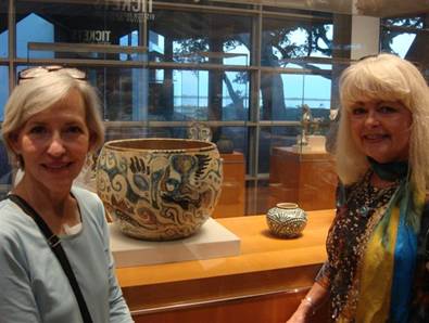 Chris Jones and Suzy Moss, members of the Ohr-O’Keefe Museum of Art’s Board of Trustees, enjoy the exhibition of Shearwater Pottery after Dr. Hogan’s lecture.