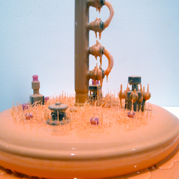 The work has the feeling of small worlds, the exhibit like a tiny, disturbing amusement park.