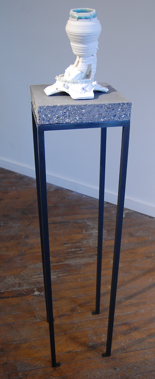 Terri Saulin Frock, "Perforated Stretcher Bond w/ Projecting Fins" showing the tall steel and concrete pedestal.