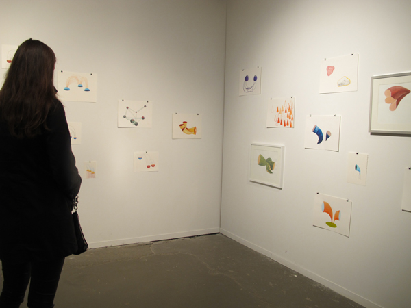 A wall of concept drawings, including "Listening Indicators" (framed)