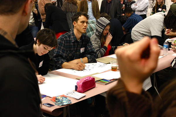 Artist Hamilton Poe did portraits from the crowd without looking at the paper.