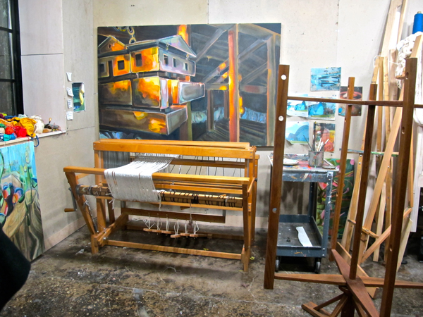 Schubatis' studio space shows the ephemera of both her painted and woven works.