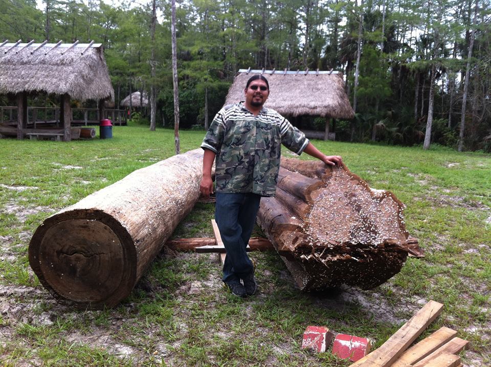 Pedro with two logs. 