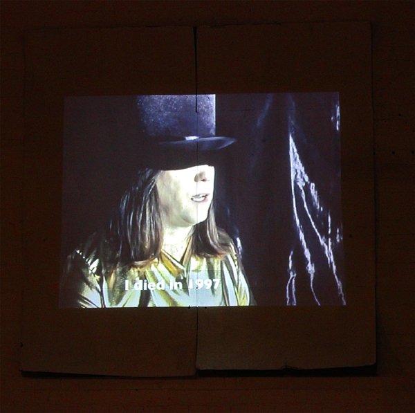 Art historian impersonates Byars in a video on display in the exhibit.
