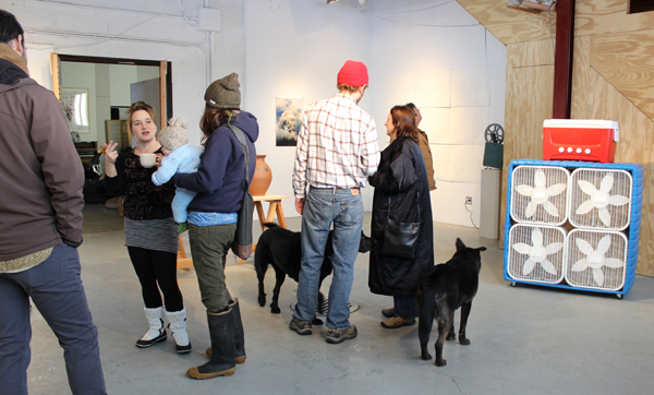 The crowd milling around Popp's exhibition space prior to the talk.