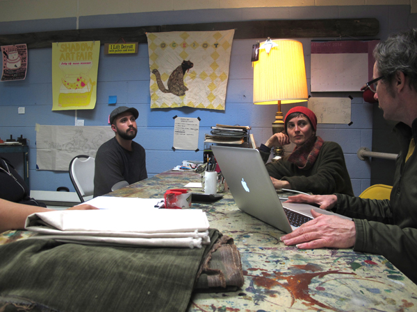 Kurth (far right) and Kemp (second from right) consult with students on the relative merits of Photoshop versus Illustrator.