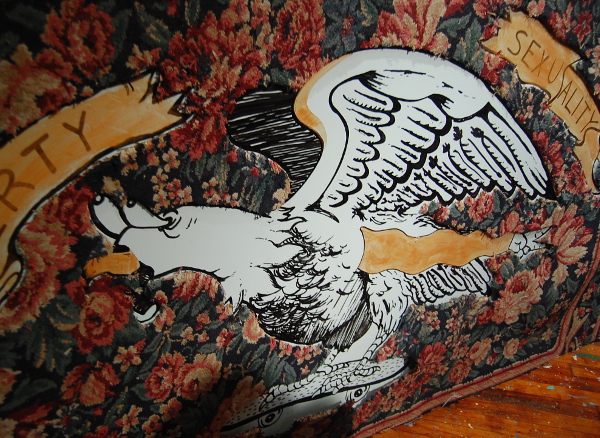 An eagle cut out of a carpet.