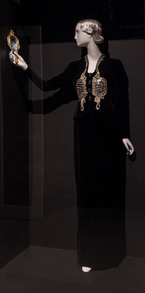 Elsa Schiaparelli, Evening Jacket, Winter 1938-39, silk velvet, crepe, metallic thread, beads, glass mirror and plastic, courtesy of the Metropolitan Museum of Art. Gift of Mrs. Pauline Potter, 1950 (C.I.50.34.2). Installation view at the Bass Museum of Art. Photo by Silvia Ros. Courtesy of the Bass Museum of Art.