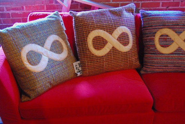 Pillows affixed with the infinity symbol.