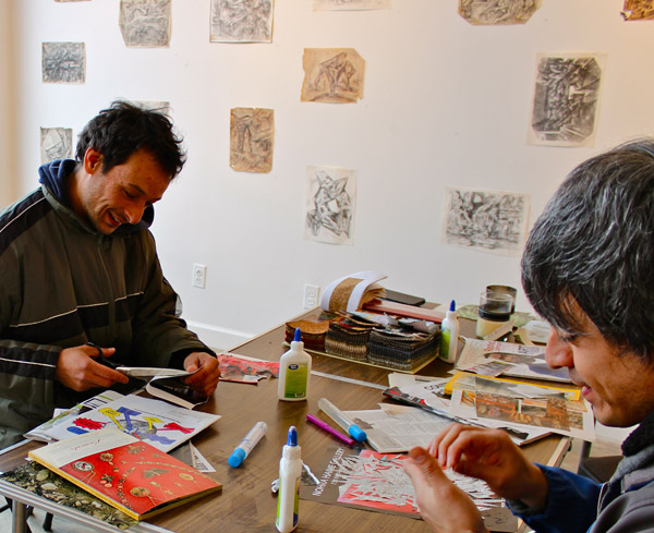 Martin Anand (left) and his friend Bruno working on collages at Public Pool.