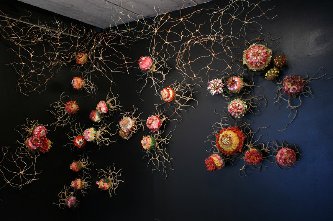 Alison Hiltner, Mimicry, 2009-2011. Mixed Media: Artificial Flowers, Wax, Clay, Wire, Hamster Runabouts and a variety of other things found and made. Photo courtesy of the artist's website.