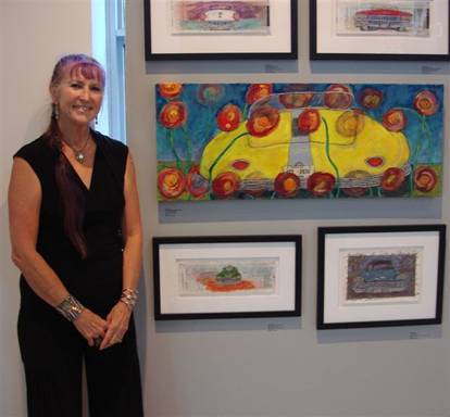 Artist Carole Marie with some of her car art