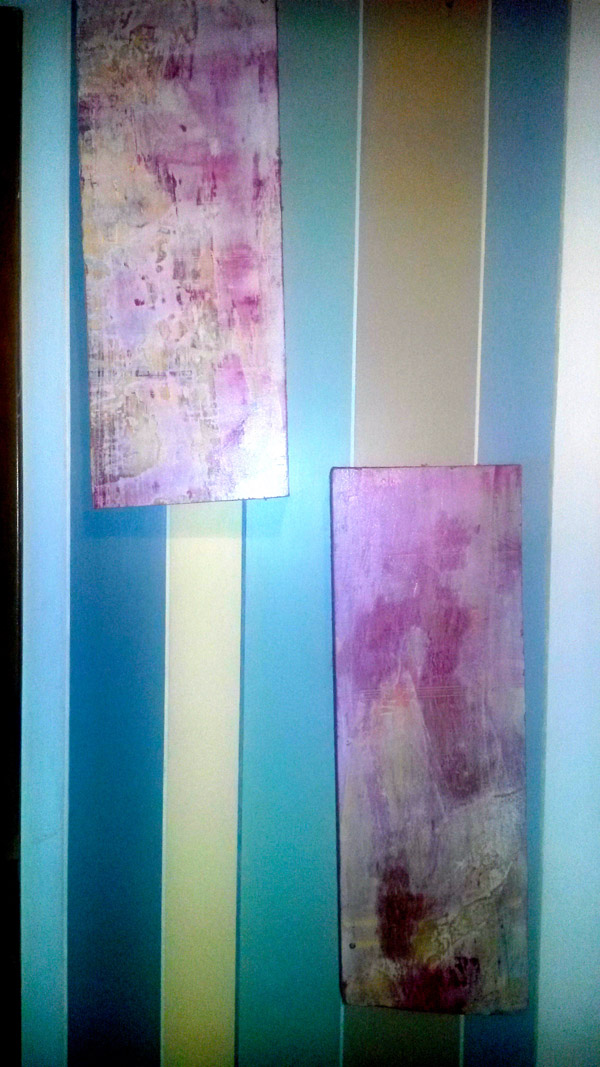 Some of Anand's paintings, created by a process of reduction, using sanders, or other tools to create an uncannily smooth finish.