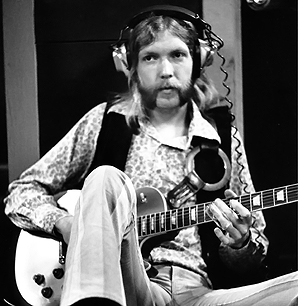 Duane "Skydog" Allman playing his guitar in a recording session.