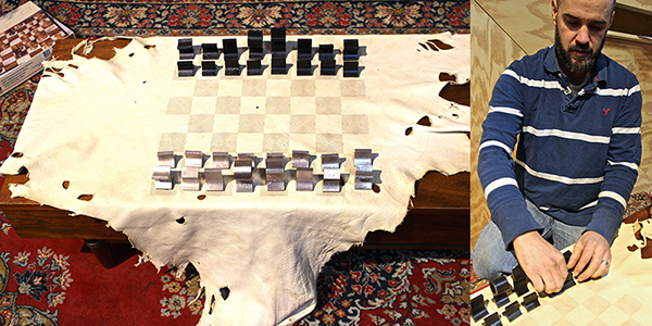 Gallerist Graem Whyte explains the process of extrusion-molding his "Extrusion &squot;59" chess set, paired with Aaron Blendowski&squot;s laser cut leather "Endgame" board.