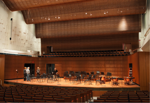 Before musicians arrived, SPCO Technical Director Jon Kjarum adjusted stands and chairs.