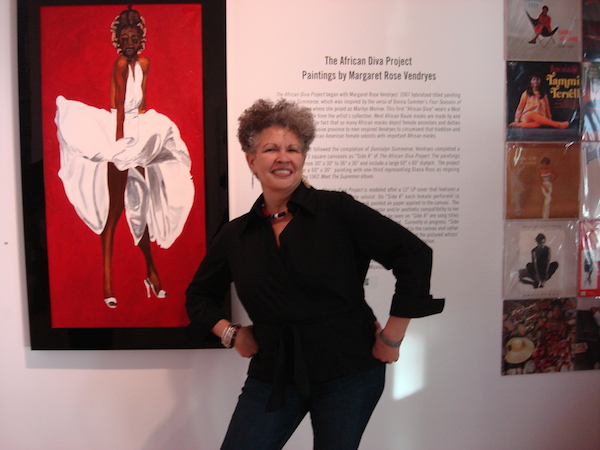 Artist Margaret Rose Vendryes poses before Donnalyn Summeroe, the painting that inspired the project. 