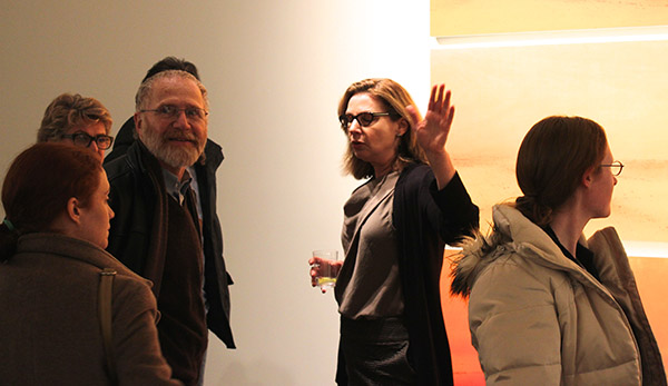 Campbell (center) speaks with admirers at the opening reception.