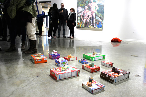 A collection of shoes with boxes by Mike Swaney, in the foreground.