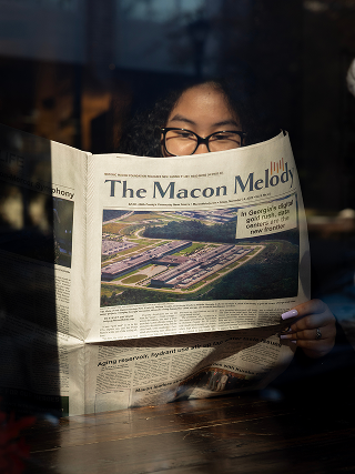 Woman reading a newspaper